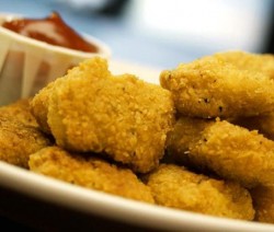 Chicken Nuggets on a Plate with Ketchup